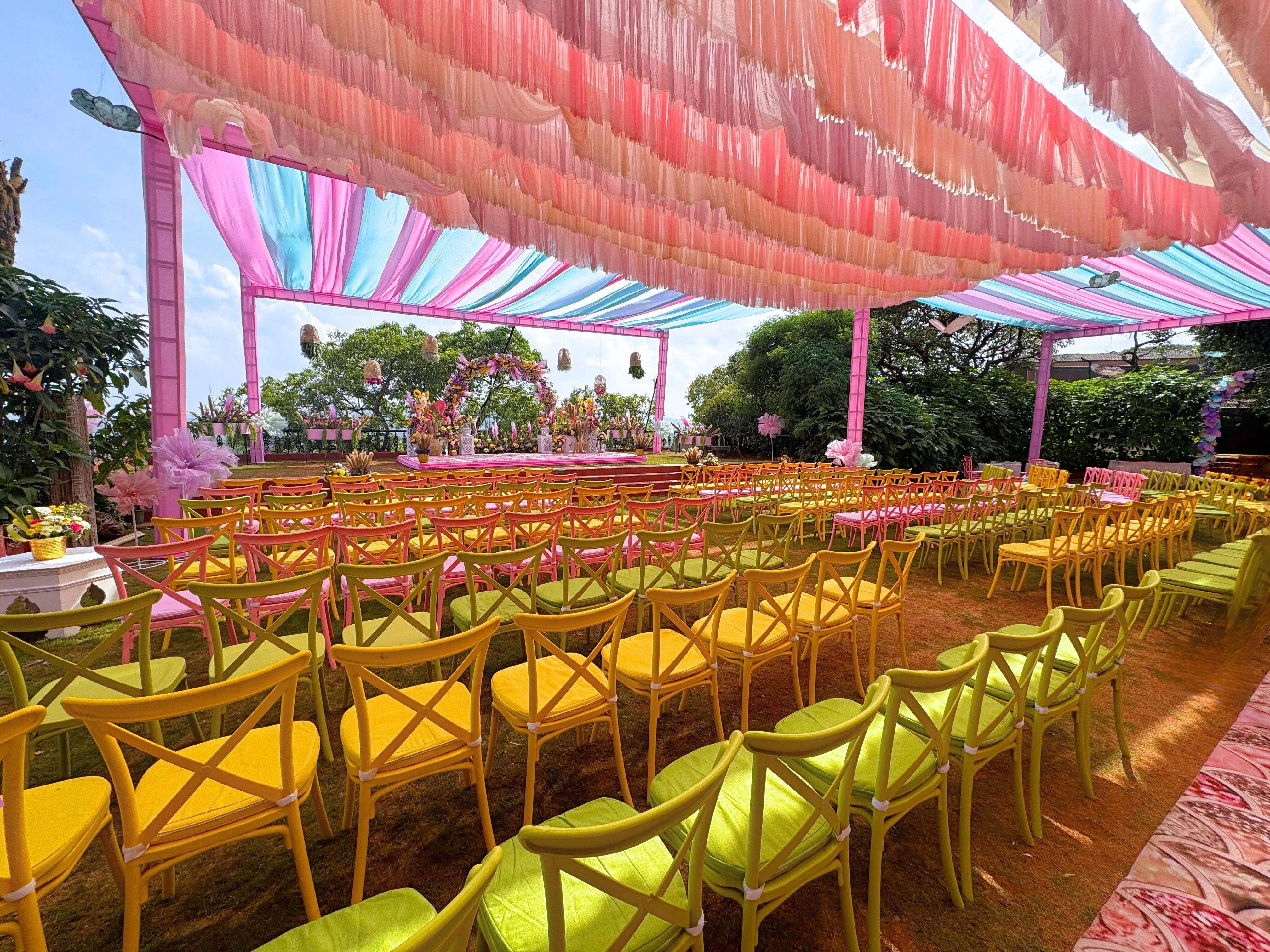 Large wedding reception seating arrangement on the lawn at Ramsukh Resort, Mahabaleshwar, with colorful decor.